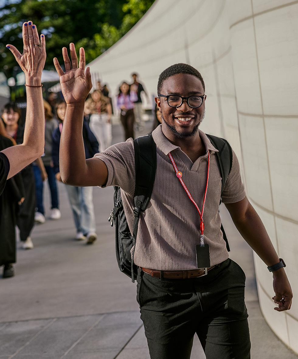 Distinguished Winner AJ Nettles from USA high-fives an attendee during WWDC at Apple Park, creator of CryptOh security app